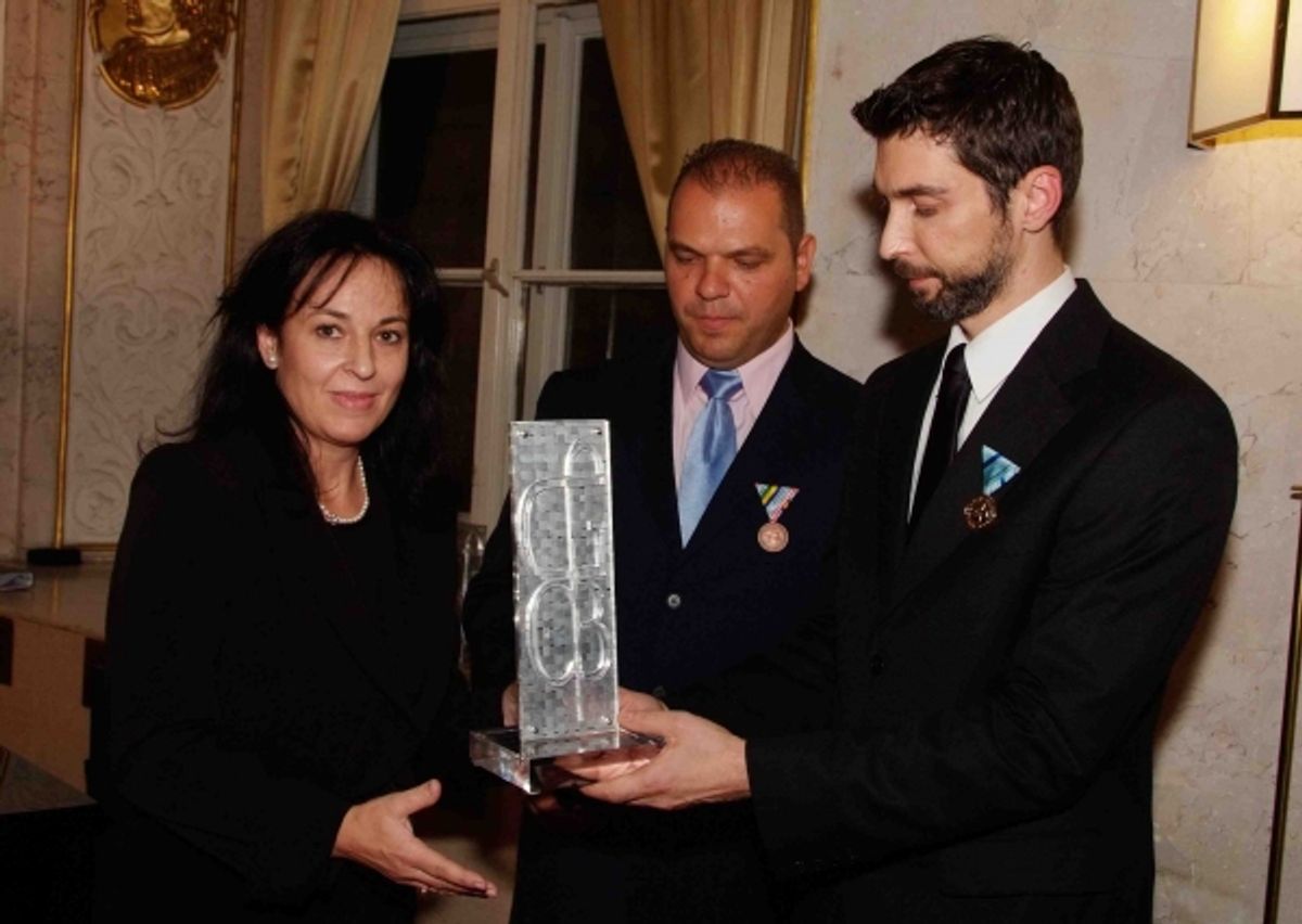 Ms. Maria Lemoni receiving the award from the George Ã¢â‚¬Å“BestÃ¢â‚¬Â Costacos Cultural and Cancer Research Foundation on behalf of the family of the late Metropolitan of Austria, His Eminence Metropolitan Michael Staikou at George “Best” Costacos Awarded Posthumously In Austria