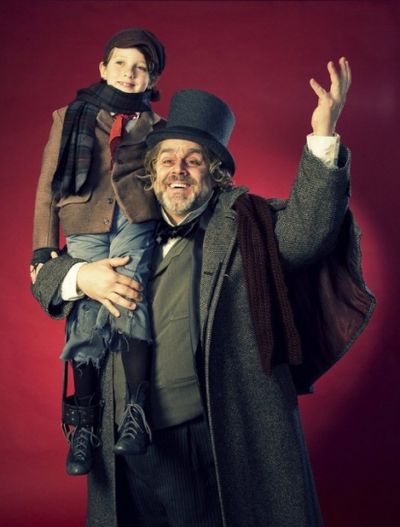 Price Clark as Tiny Tim and David Benoit as Scrooge Photo