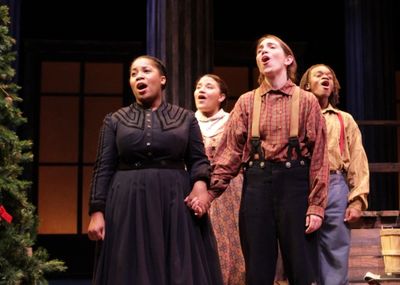 From left to right: Joetta Wright, Alicia Dansby, Jen Rand, and Jackson Hurst hold on Photo