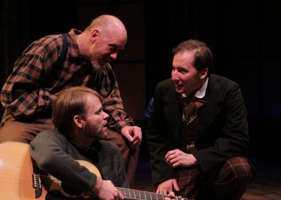 John Wilkes Booth (David Maga, right) conspires with two fellows at his boarding hous Photo