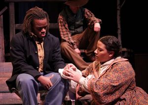A nurse (Alicia Dansby) wraps the wound of a soldier (Jackson Hurst) in A Civil War Christmas. @ BroadwayWorld A nurse (Alicia Dansby) wraps the wound of a soldier (Jackson Hurst) in A Civil War C Photo