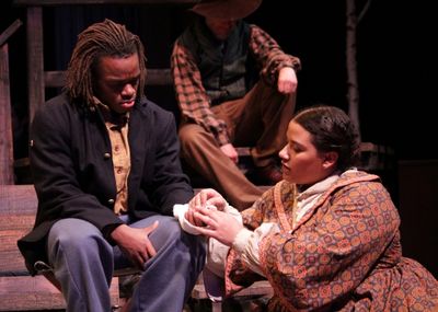 A nurse (Alicia Dansby) wraps the wound of a soldier (Jackson Hurst) in A Civil War C Photo