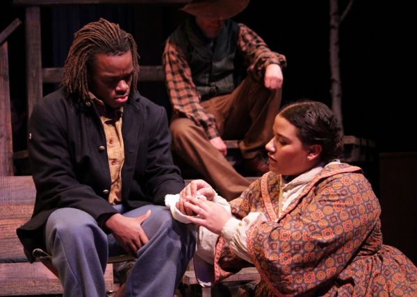 A nurse (Alicia Dansby) wraps the wound of a soldier (Jackson Hurst) in A Civil War C Photo