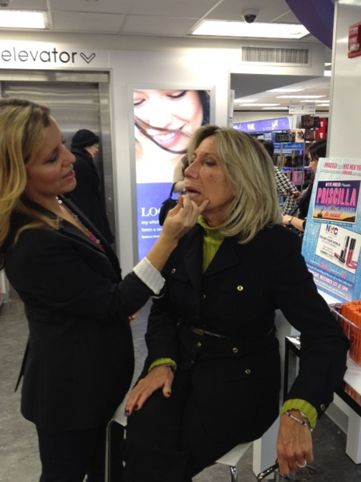 Celebrity makeup artist Erica Whelan gives a fan a Priscilla makeover at 