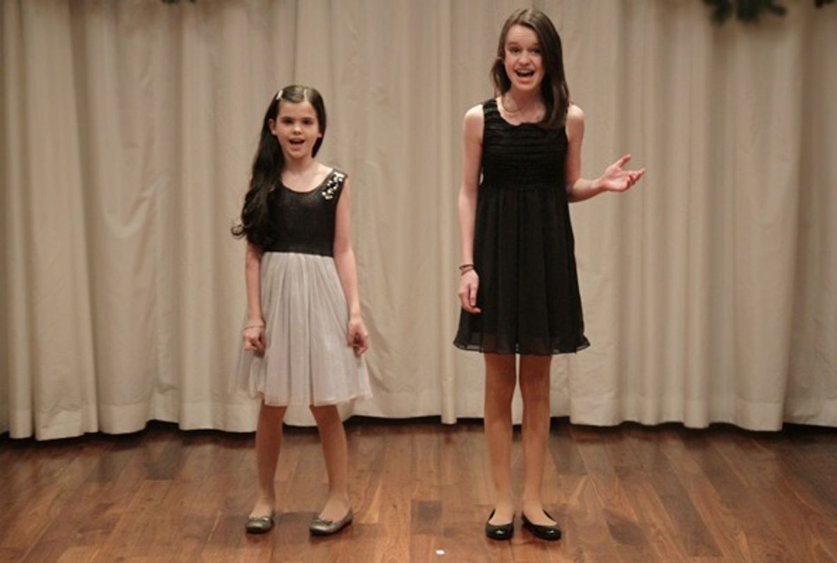 Cassady Leonard (Mary Poppins) and younger sister, Devin, sing 'I Saw Mommy Kissing Santa Claus.' at 