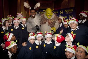Richard Blackwood (Donkey) and Nigel Lindsay (Shrek) backstage with students from Blessed Sacrament RC Primary School backstage at Shrek The Musical at the Theatre Royal Drury Lane, London, England on 15th December 2011 @ BroadwayWorld Richard Blackwood (Donkey) and Nigel Lindsay (Shrek) backstage with students from Ble Photo