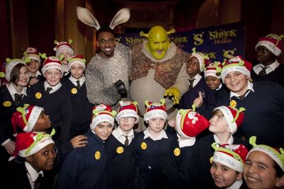 Richard Blackwood (Donkey) and Nigel Lindsay (Shrek) backstage with students from Ble Photo