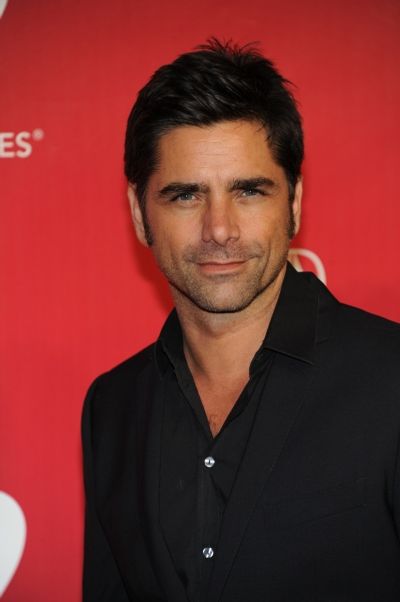 John Stamos arrives at the 2012 MusiCares Person Of The Year Gala Honoring Paul McCar Photo
