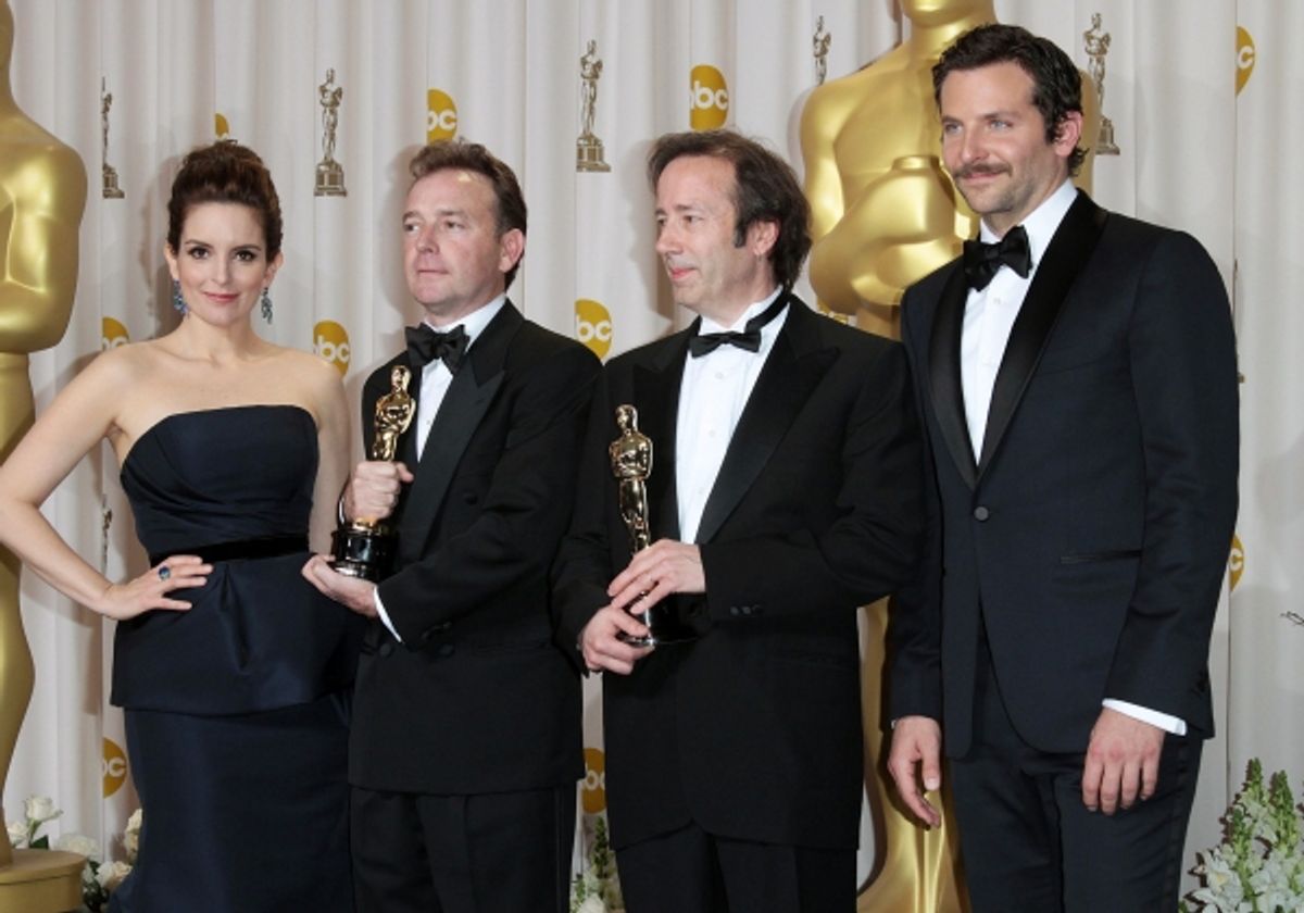 Tina Fey and actor Bradley Cooper pose with Eugene Gearty (second from left) and Philip Stockton (second from right), winners of the Sound Editing Award for 'Hugo' at 