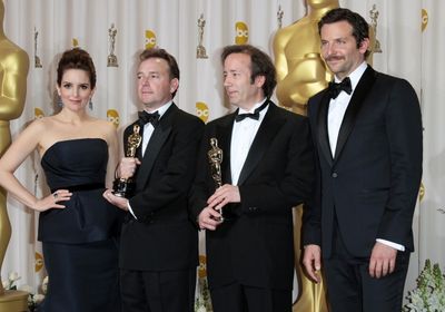 Tina Fey and actor Bradley Cooper pose with Eugene Gearty (second from left) and Phil Photo