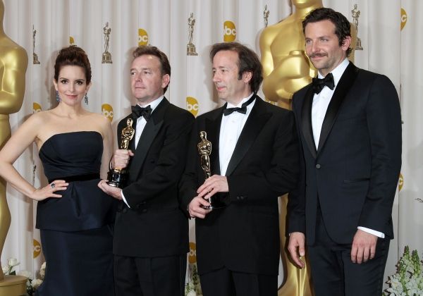 Tina Fey and actor Bradley Cooper pose with Eugene Gearty (second from left) and Phil Photo