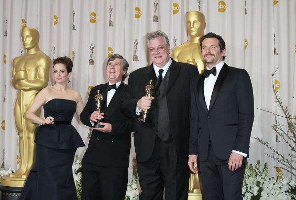 Tina Fey and actor Bradley Cooper pose with Eugene Gearty (second from left) and Phil Photo