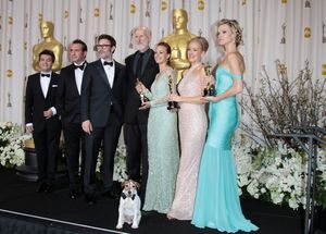 Producer Thomas Langmann, actor Jean Dujardin, director Michel Hazanavicius, actors J Photo