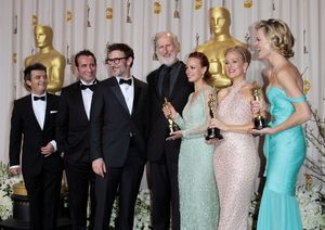 Producer Thomas Langmann, actor Jean Dujardin, director Michel Hazanavicius, actors J Photo