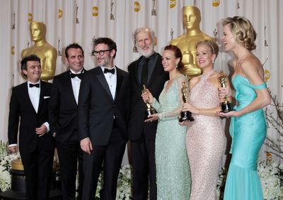 Producer Thomas Langmann, actor Jean Dujardin, director Michel Hazanavicius, actors J Photo