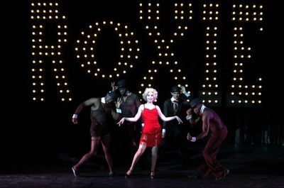Alexis Grace (center) portrays murderess Roxie Hart in the Theatre Memphis production Photo