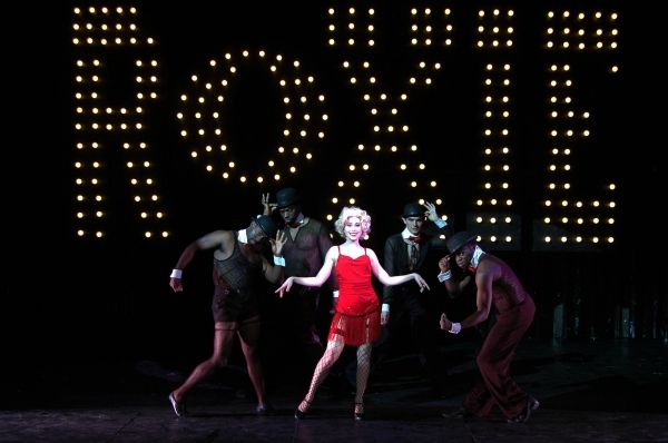 Alexis Grace (center) portrays murderess Roxie Hart in the Theatre Memphis production Photo