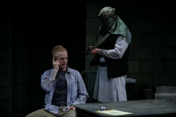John Hickok as Nick and Michael James Reed as the guard Photo