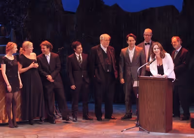 Jennifer Pollono accepts the Production Award for Small Engine Repair with members of Photo