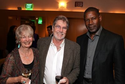 CTG Donors Joni Benickes and Miles Benickes pose with celebrity judge Dennis Haysbert Photo