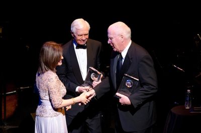 Kay Kapoor, of Accenture Federal Services, presents the American Voice Awards to sena Photo