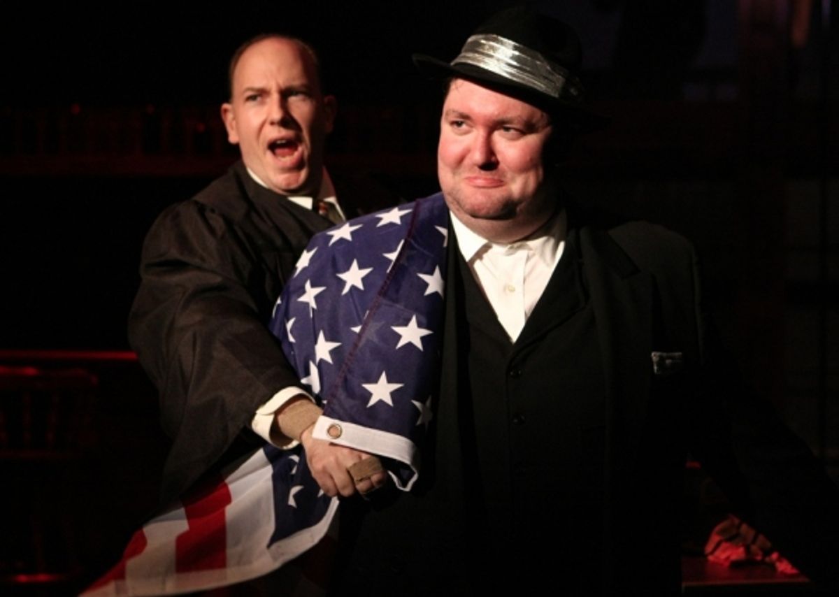 J. Edgar Hoover (E.J. Subkoviak) is wrapped in an American flag by the narrator (Jake Endres). at 