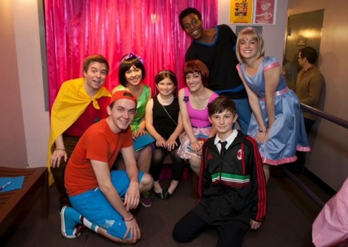 A.J. Patton, Lora Nicolas, Ryan Mikita, Laura Weiner, Bryce Payne, and Madison Turner engage in a photo op with young theatergoers at 