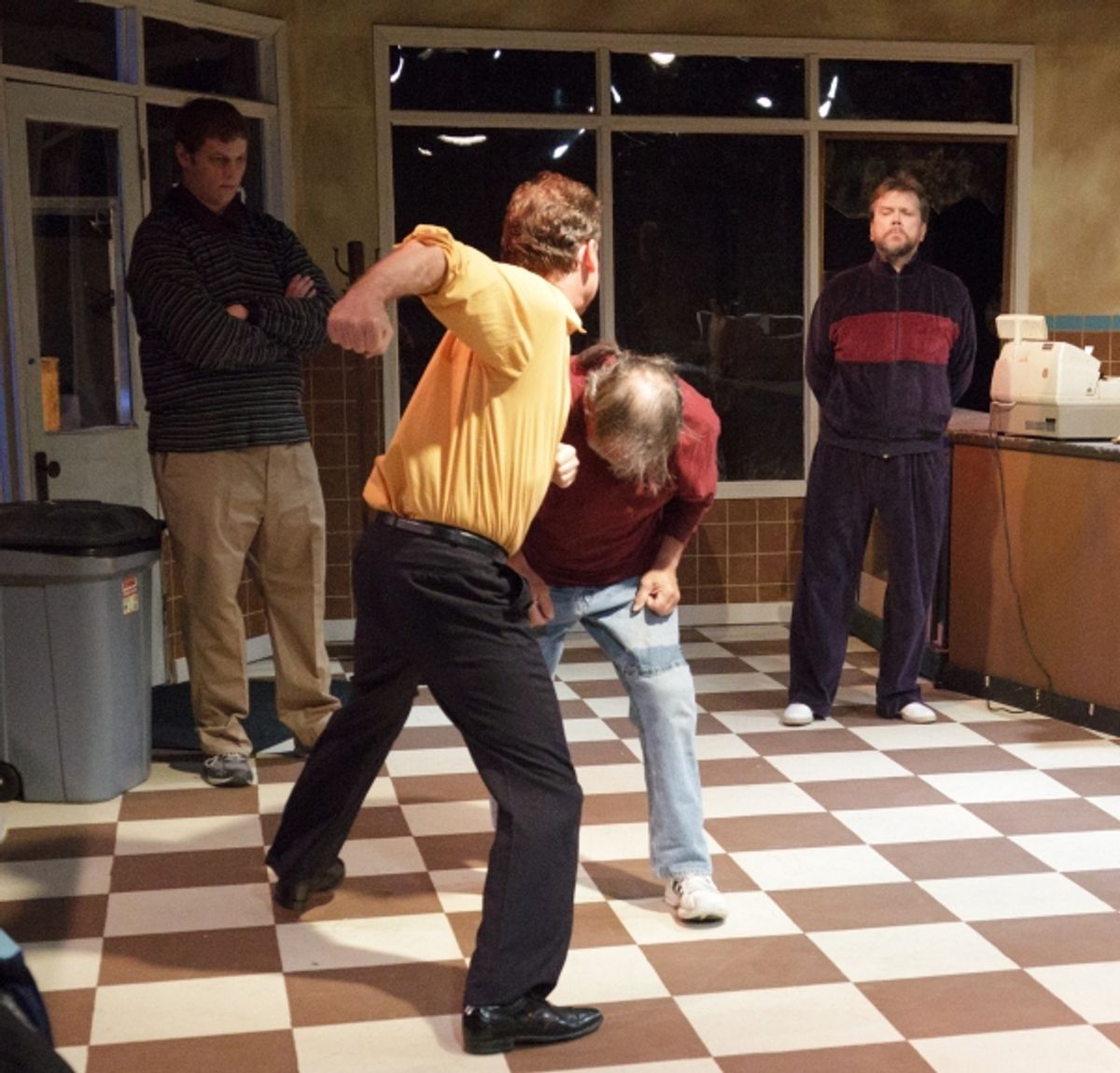 Bill Svelmoe punches Gary Oesch; Joseph Goepfrich and David Chudzynski look on at 