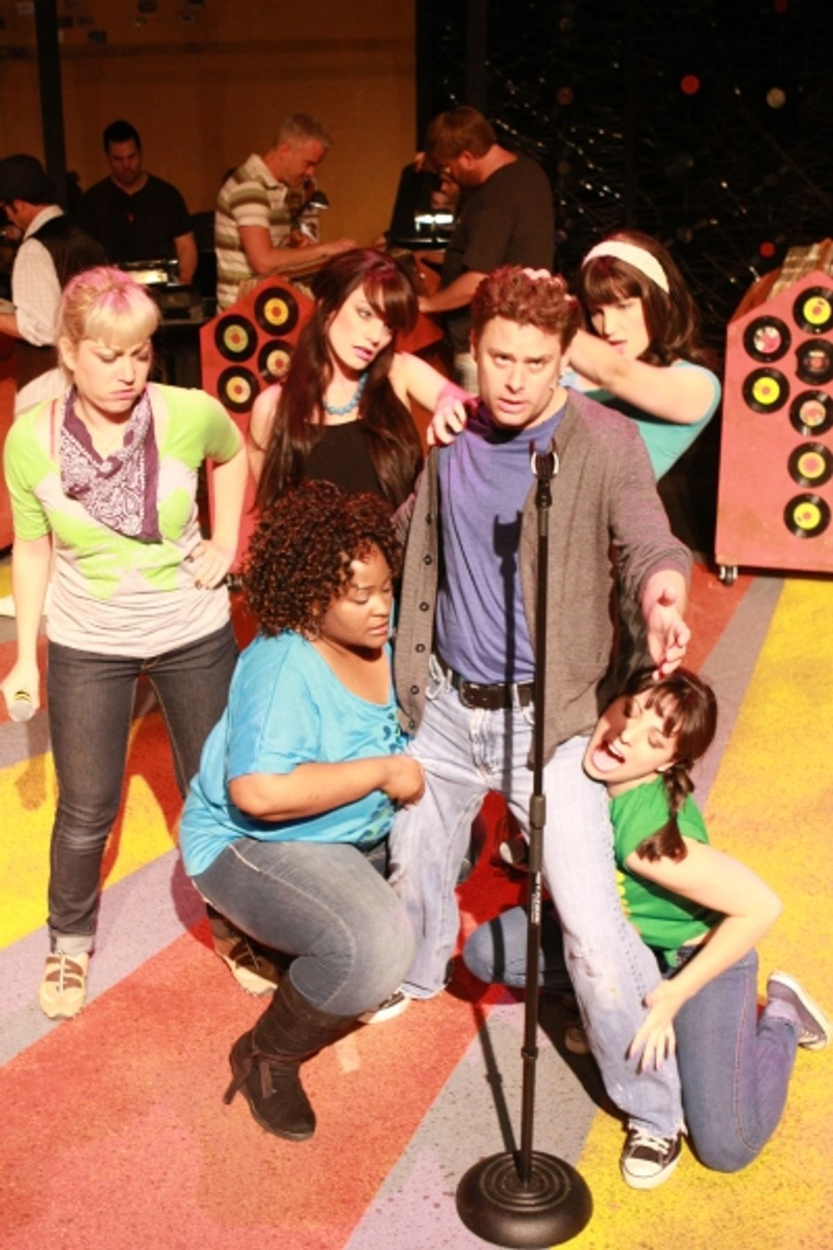 Jeffrey M. Wright as Rob Gordon, surrounded by Rob's Ex-Girlfriends at 