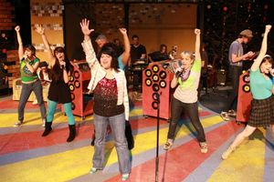 Kimi Short as Laura (in front) singing "Number 5 With a Bullet," with Rob's Ex-Girlfr Photo