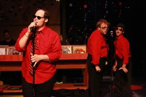 Zachary Allen Farmer as Barry, singing the finale, "Turn the World Off," backed up by Nicholas Kelly as Klepto-Boy and Todd Micali as TMPMITW @ BroadwayWorld Zachary Allen Farmer as Barry, singing the finale, "Turn the World Off," backed up by Photo