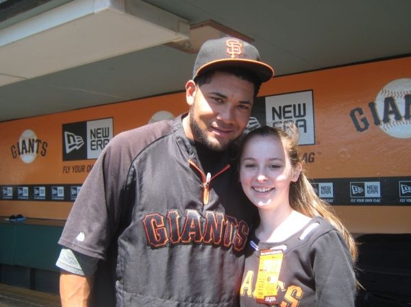 Julia Belanoff with Giants left-fielder Melky Cabrera Photo