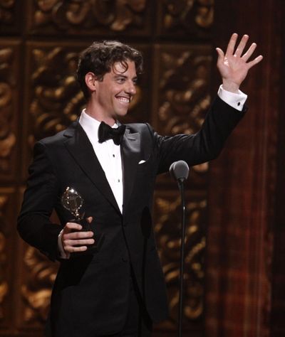 Christian Borle holds the award for best performance by an actor in a featured role i Photo
