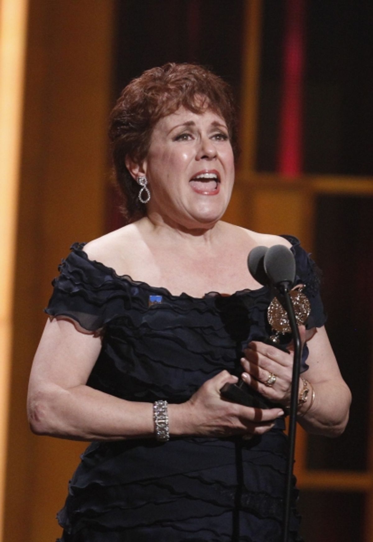 Judy Kaye holds her award for best performance by an actress in a featured role in a musical for 'Nice Work If You Can Get It'
 at 