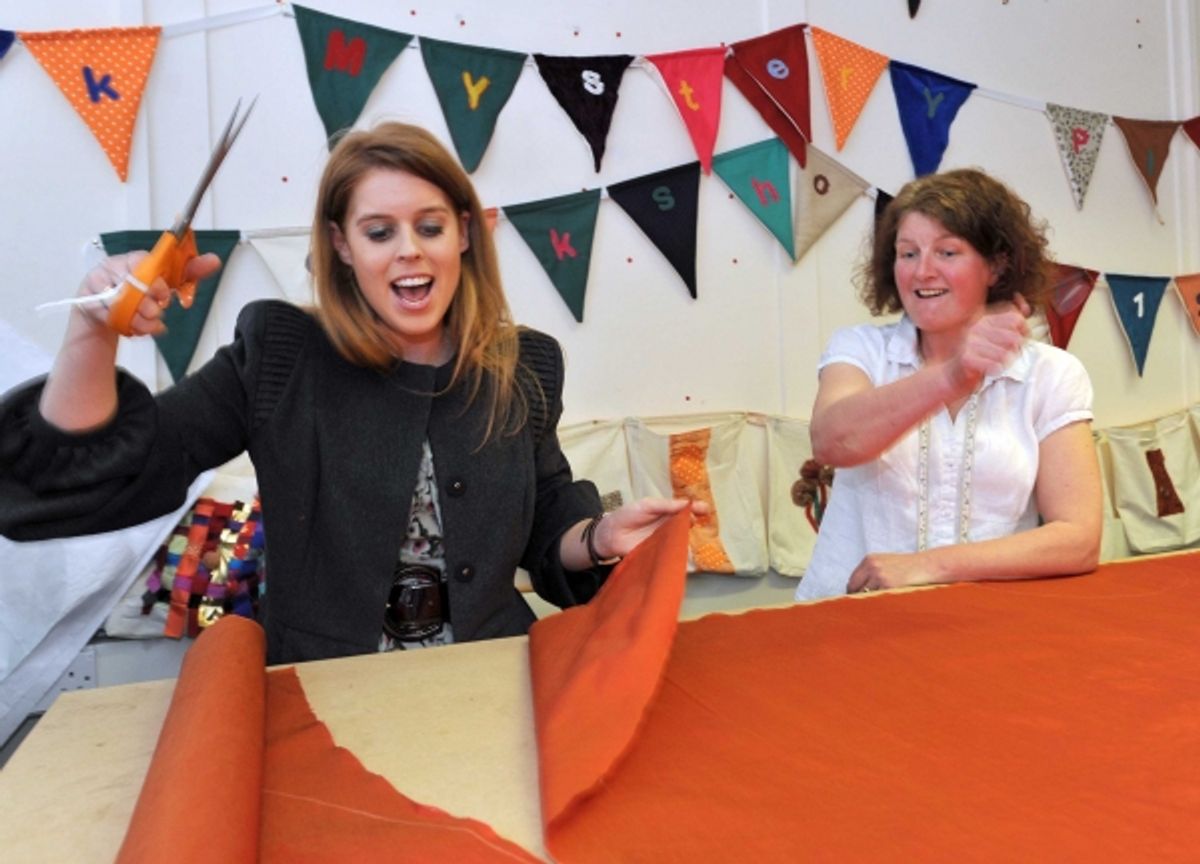 HRH Princess Beatrice successfully tries her hand at pattern cutting as she scissors her way through material for an angel costume at 