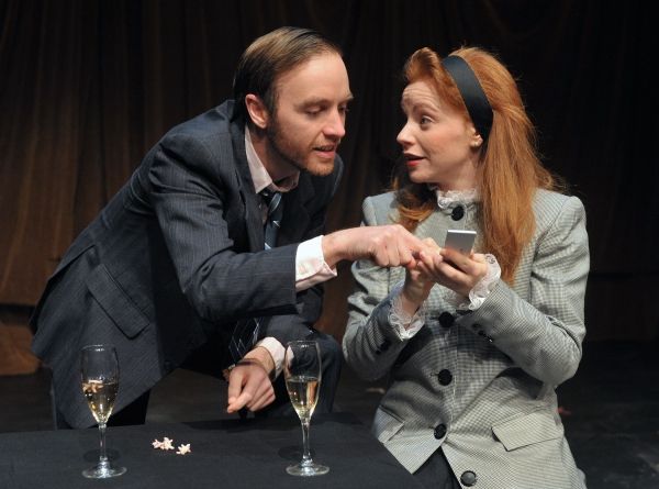 James O. Dunn as Grimes and Tara Giordano as Scilla Todd in Serious Money Photo