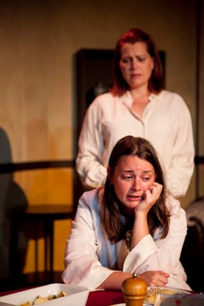 Julia Giolzetti (background) Molly Lovell in a scene from Long View Theater Company's Photo