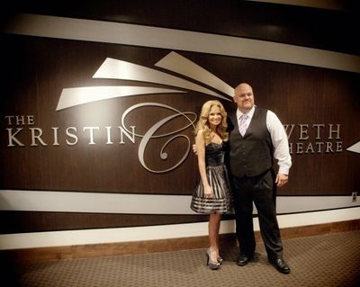 BAPAC Executive Director and Kristin in front of her new wall decoration 
in the lob Photo